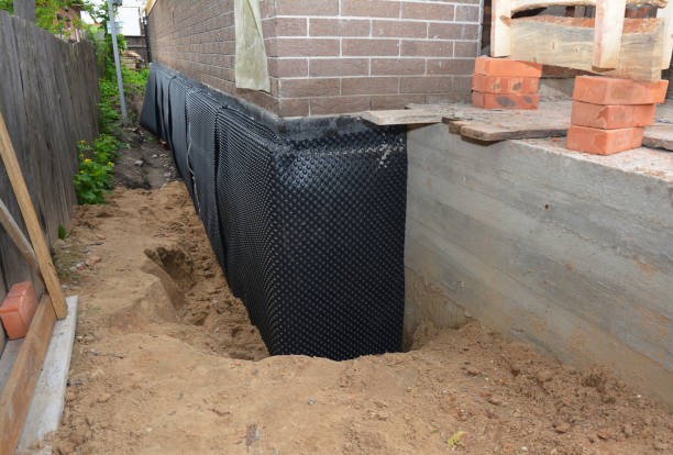 Happy homeowners after waterproofing job in Underwood